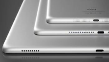 Blog image iPads stacked on each other on black table
