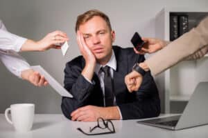 Blog image business man tired of being overloaded at work