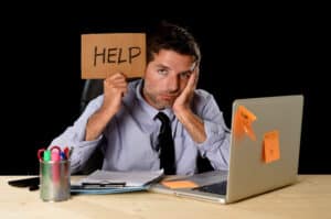 Blog image tired desperate businessman in office stress working asking for help