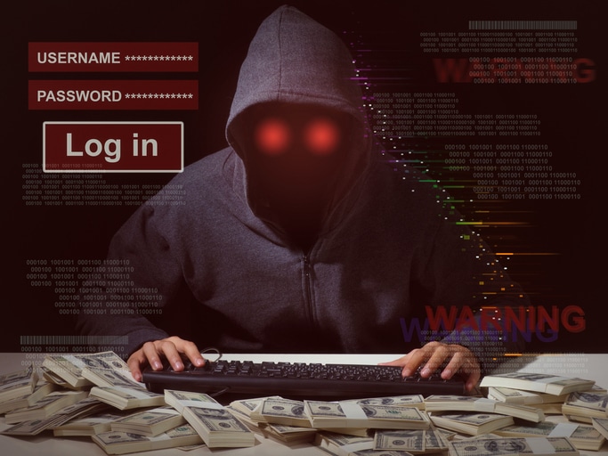 Blog image Cyber attack with unrecognizable hooded hacker.Man in hoodie is hacker
