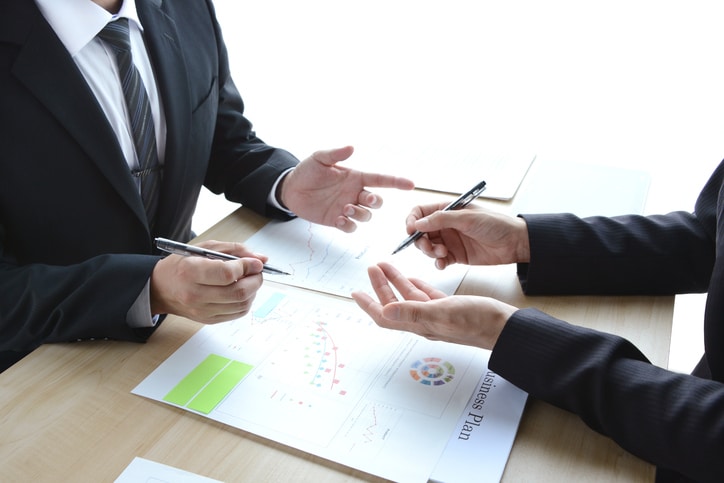 Blog image business meeting discussion charts