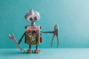Blog image robot holding tools on a light blue background