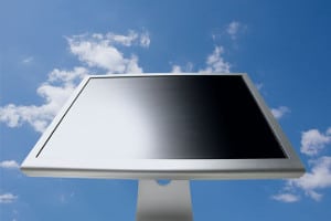 Computer monitor with background of blue sky and clouds