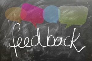 Feedback written on chalkboard with speech bubbles above