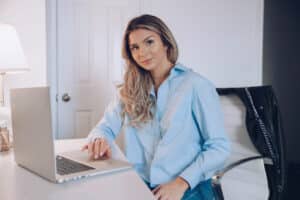 Woman at desk using laptop
