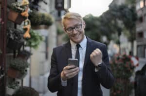 Man excited after looking at phone
