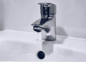 dripping faucet to illustrate the data water data breach