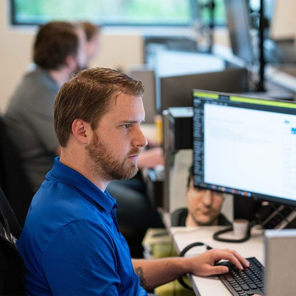 Man Working At Computer Desk