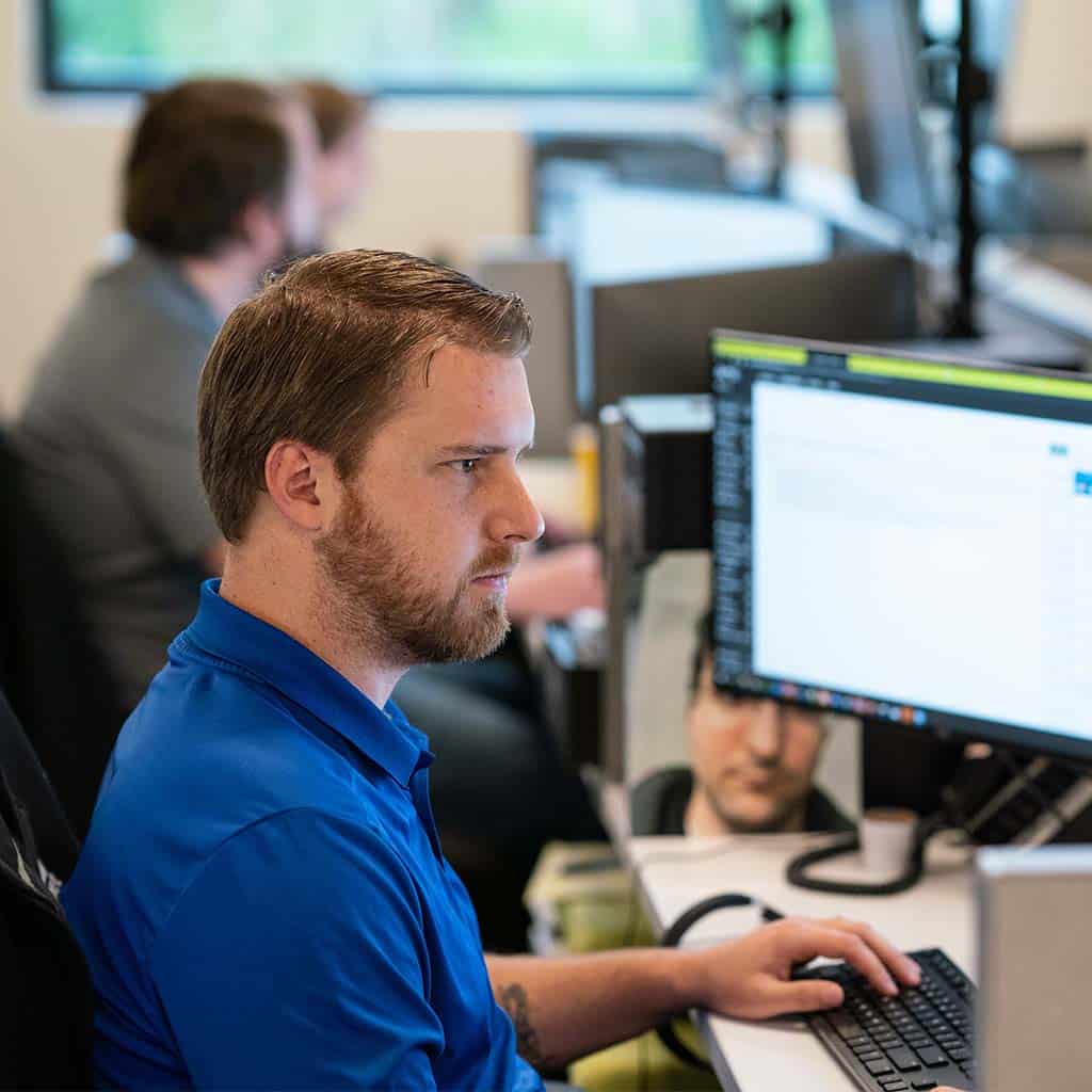 Man Working At Computer Desk