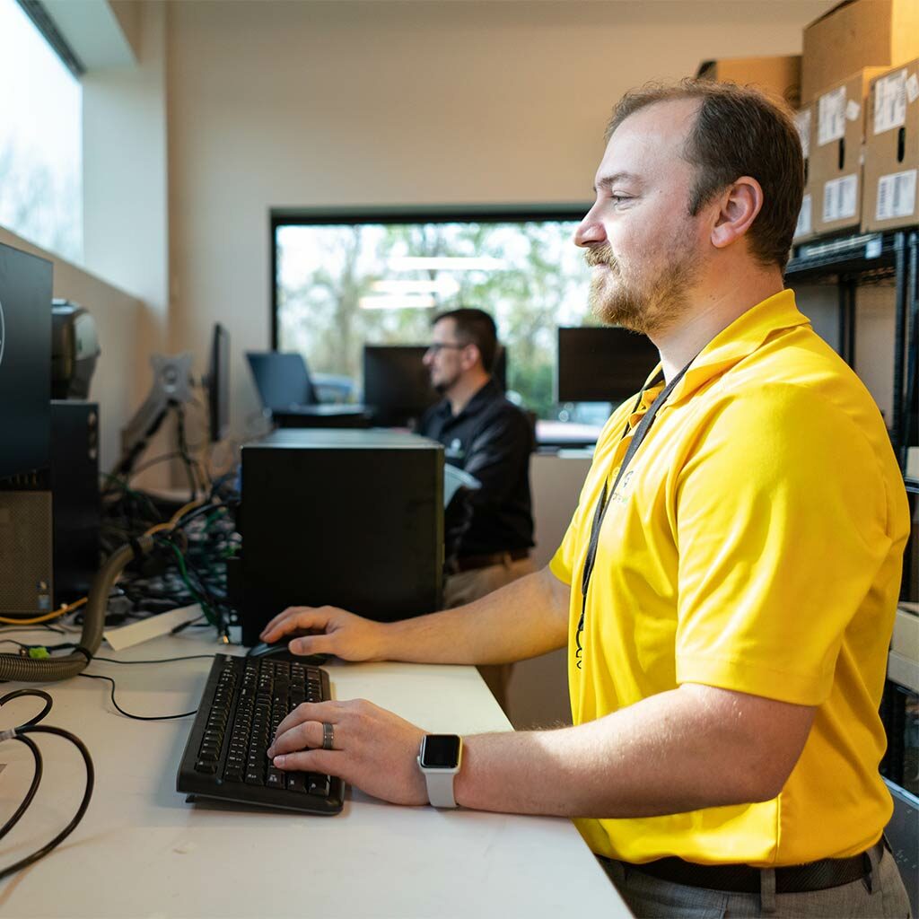 Throttlenet-Man at desk in St. Louis