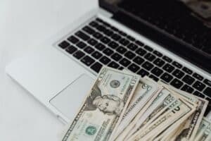 Money on laptop keyboard
