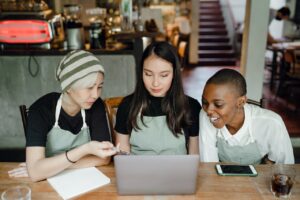 three women having a small business meeting