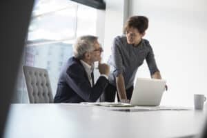 business colleagues in office discussing cybersecurity strategy