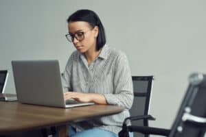 business woman at work researching cloud migration risks for company security