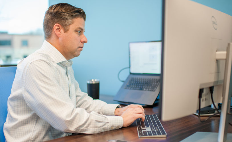 IT Support for Professional Services man at Computer